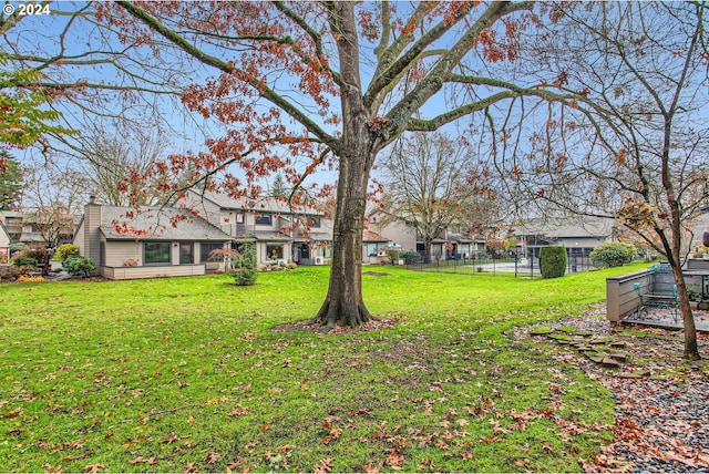 view of yard featuring a residential view and fence