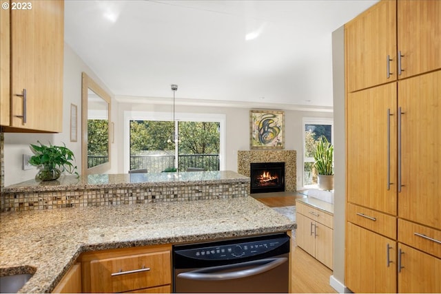 kitchen featuring light hardwood / wood-style floors, light stone countertops, and tasteful backsplash