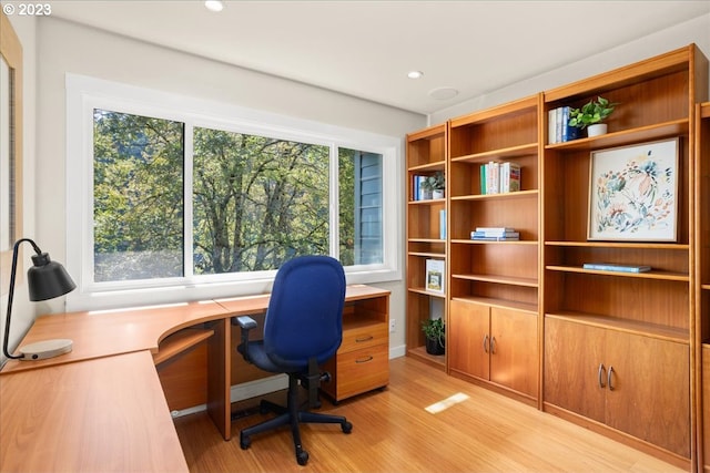 office space with light wood-type flooring