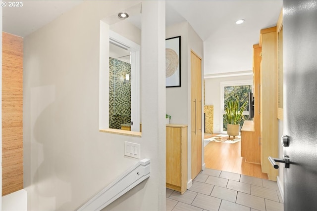 corridor with light hardwood / wood-style floors