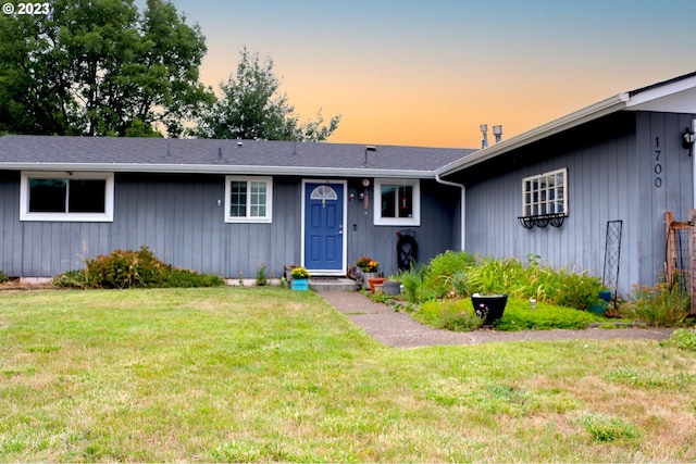 view of front of house with a yard