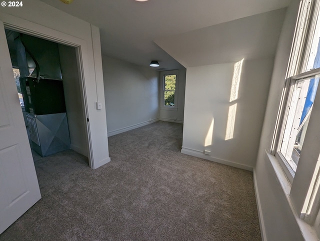 interior space featuring dark colored carpet