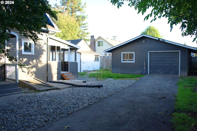 exterior space featuring an outbuilding and a garage