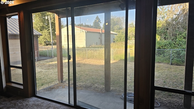 doorway to outside featuring plenty of natural light