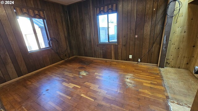 1176 SE 4th Ave, Mill City, OR 97360 - empty room with healthy amount of natural light, wood finished floors, and wooden walls