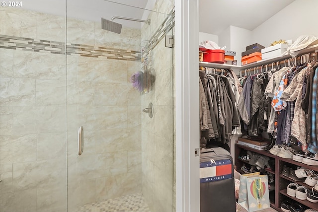 interior space with a shower with door