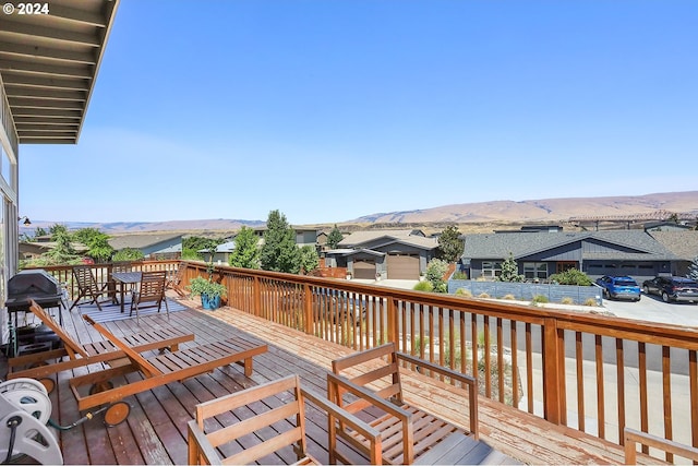 wooden terrace with a mountain view and grilling area