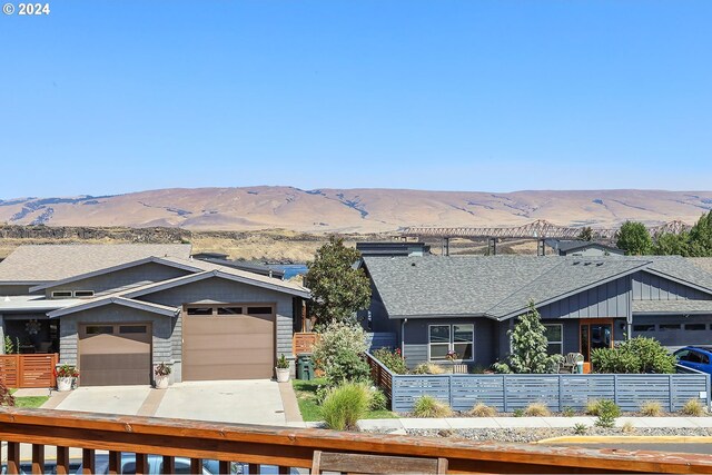 exterior space featuring a garage and a mountain view