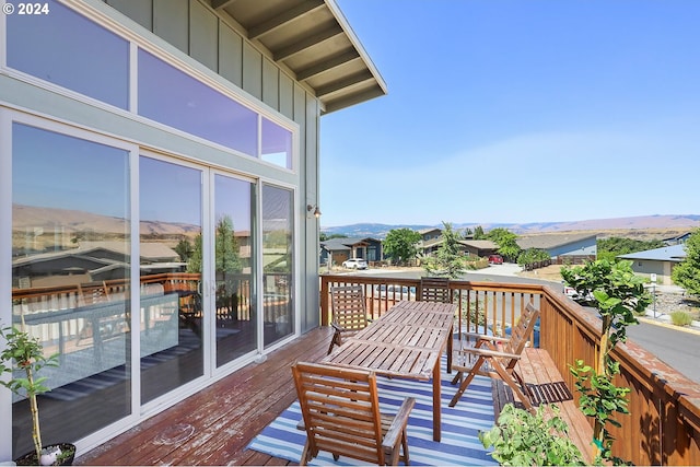 balcony featuring a deck with mountain view