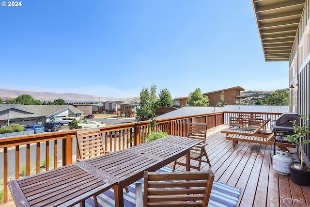 wooden deck with a mountain view