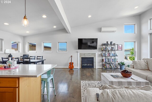 living room featuring a high end fireplace, dark hardwood / wood-style flooring, lofted ceiling with beams, and a wall unit AC