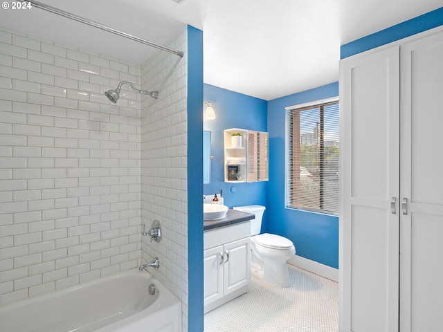 full bathroom with tile patterned flooring, vanity, toilet, and tiled shower / bath combo