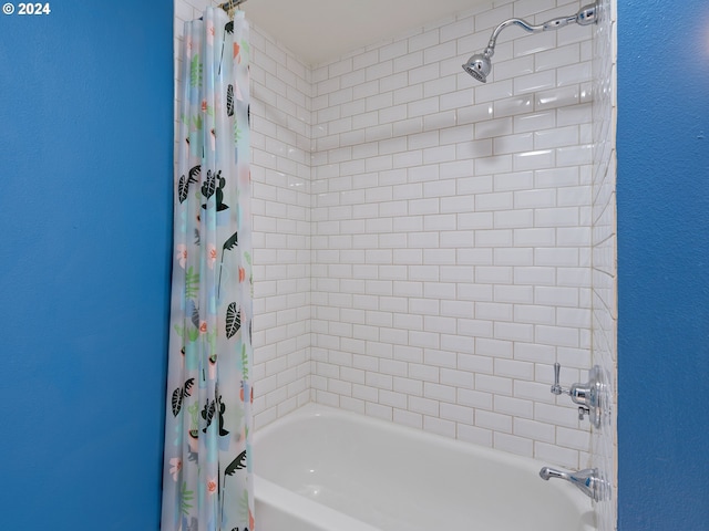 full bathroom with shower / bath combo with shower curtain