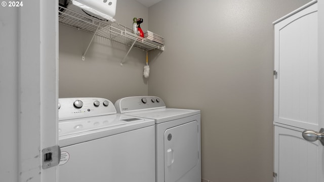 laundry area featuring washing machine and clothes dryer