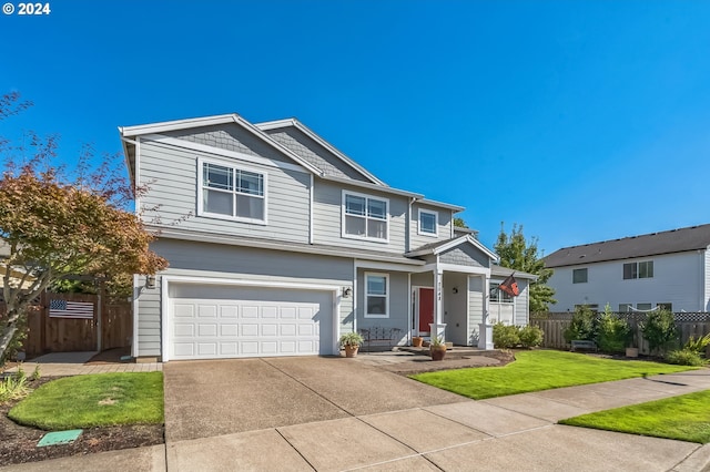 view of front of home with a garage and a front yard