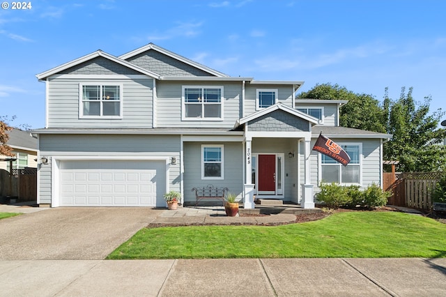 view of front facade with a garage and a front lawn