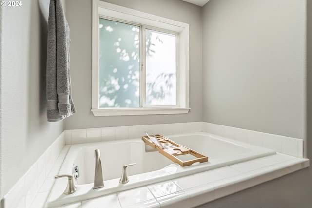 bathroom with a bathing tub and plenty of natural light