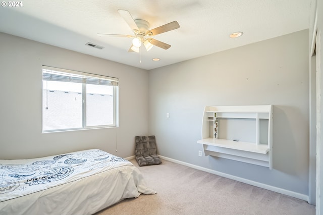 carpeted bedroom with ceiling fan