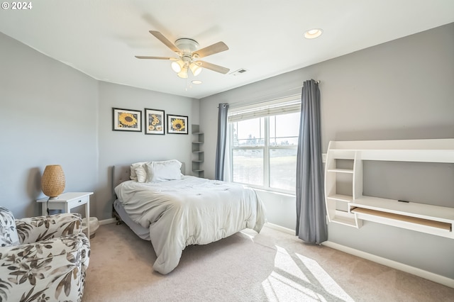 carpeted bedroom with ceiling fan