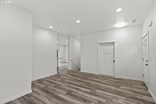 empty room with dark hardwood / wood-style flooring