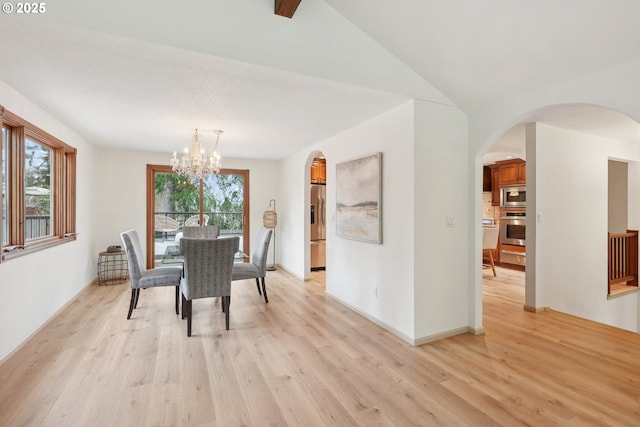 4243 Spring Rock Cir, West Linn, OR 97068 - dining room with arched walkways, a chandelier, light wood-type flooring, and lofted ceiling