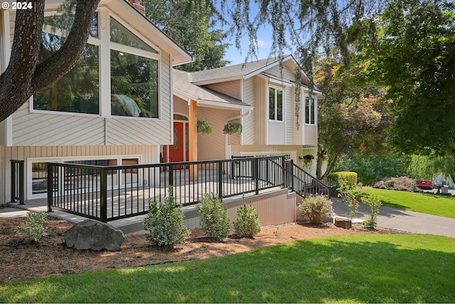 4243 Spring Rock Cir, West Linn, OR 97068 - view of front of house featuring a front lawn, an attached garage, and a chimney