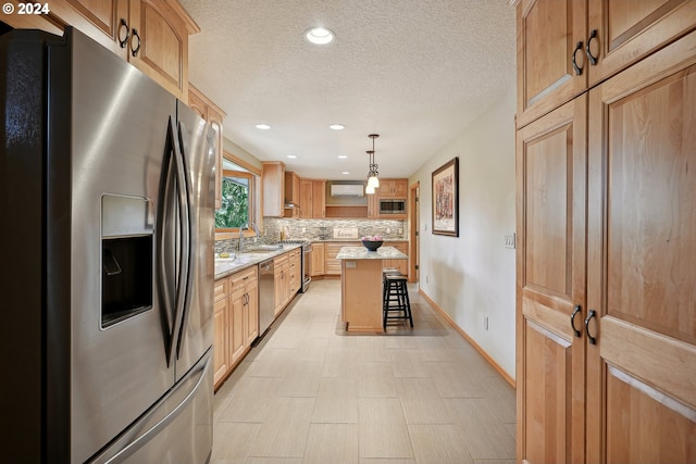 kitchen featuring a kitchen island, pendant lighting, a breakfast bar area, decorative backsplash, and stainless steel appliances