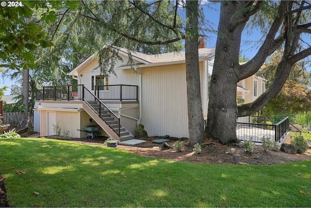 4243 Spring Rock Cir, West Linn, OR 97068 - back of property with stairs, a deck, a lawn, and a chimney