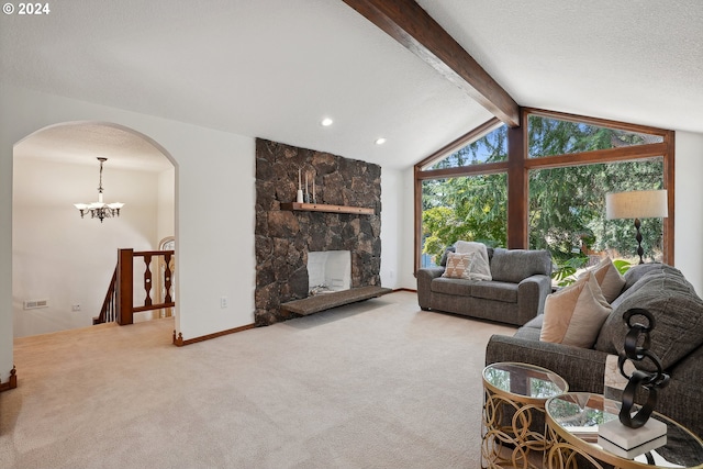 carpeted living room with vaulted ceiling with beams, a notable chandelier, and a fireplace