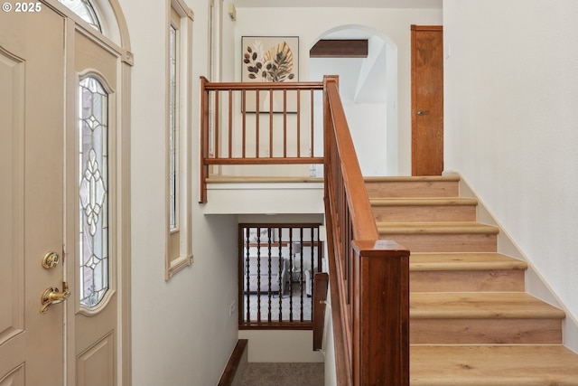 4243 Spring Rock Cir, West Linn, OR 97068 - carpeted foyer with stairway and arched walkways