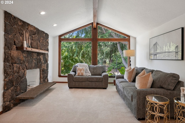 carpeted living room featuring a stone fireplace, vaulted ceiling with beams, and a textured ceiling