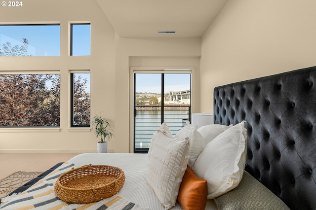 carpeted bedroom with visible vents