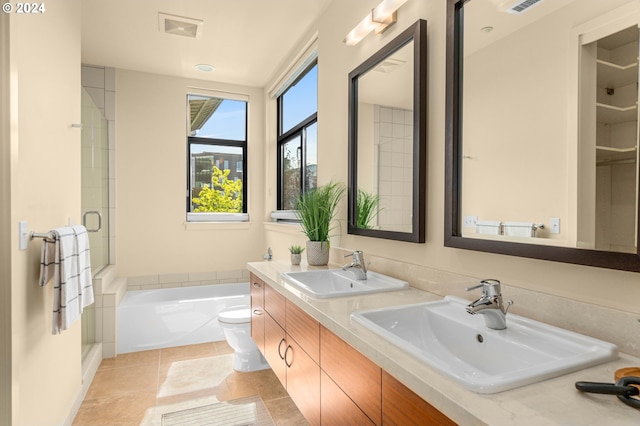 full bathroom with tile patterned floors, visible vents, a sink, and a bathing tub