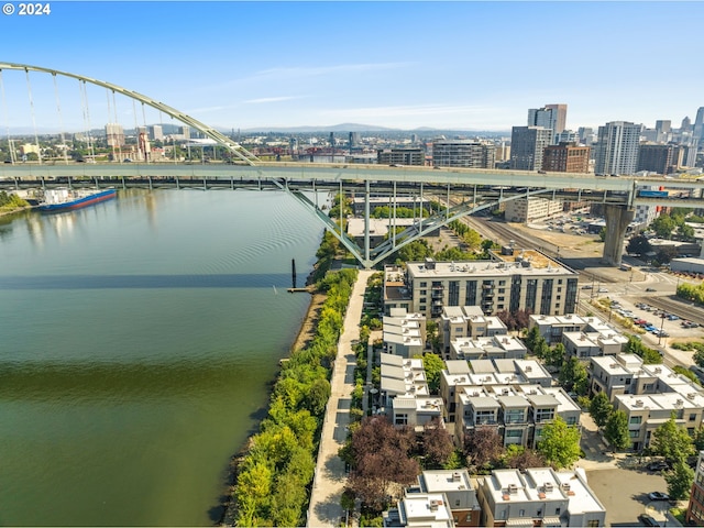 birds eye view of property featuring a view of city and a water view