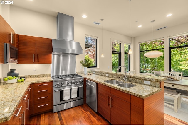 kitchen with stainless steel appliances, a sink, ventilation hood, modern cabinets, and a peninsula