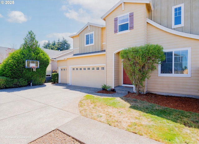 15003 NE 102nd St, Vancouver, WA 98682 - view of front facade with board and batten siding, concrete driveway, and a garage