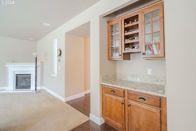 15003 NE 102nd St, Vancouver, WA 98682 - bar area with baseboards, a glass covered fireplace, and dark wood-style flooring