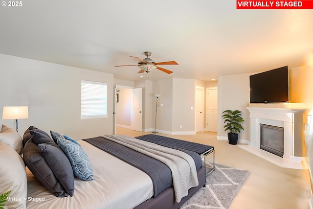 15003 NE 102nd St, Vancouver, WA 98682 - bedroom with a glass covered fireplace, light carpet, recessed lighting, a ceiling fan, and baseboards