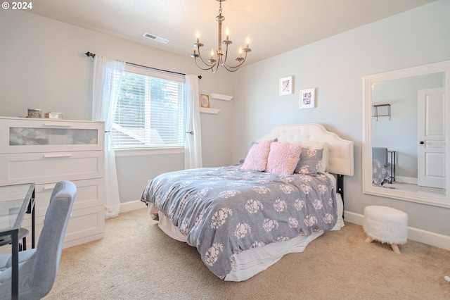 carpeted bedroom with a chandelier