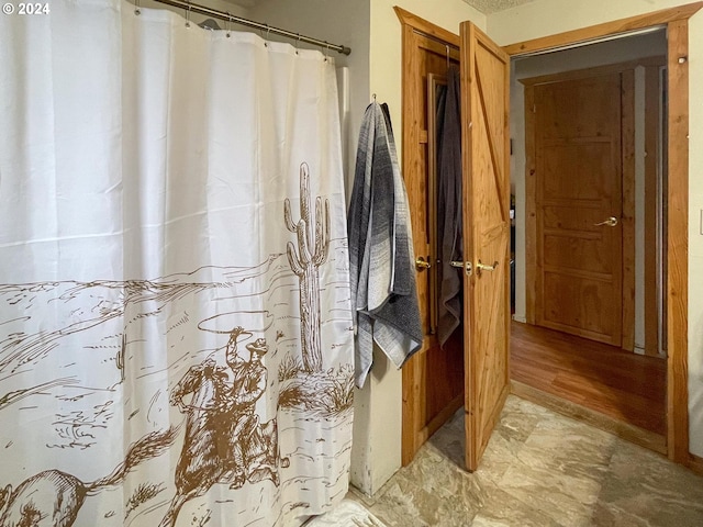 bathroom with wood-type flooring