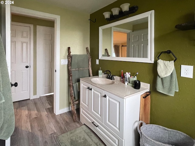 bathroom featuring wood-type flooring and vanity