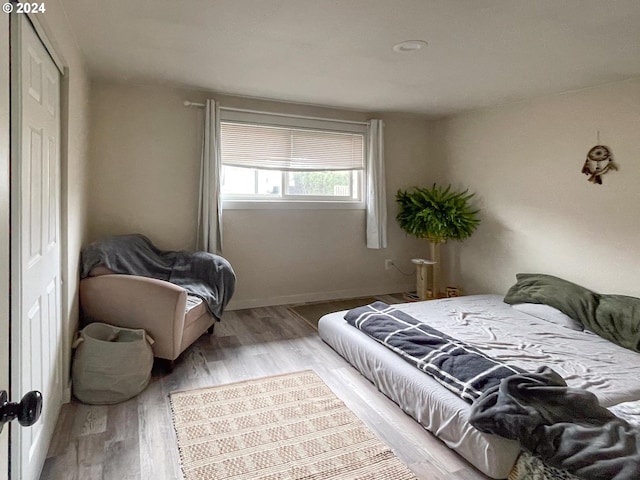 bedroom with light wood-type flooring