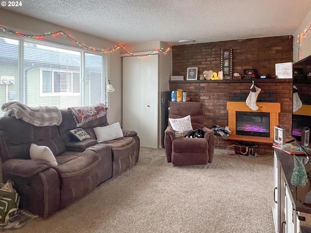 living room featuring a fireplace, carpet, and a textured ceiling