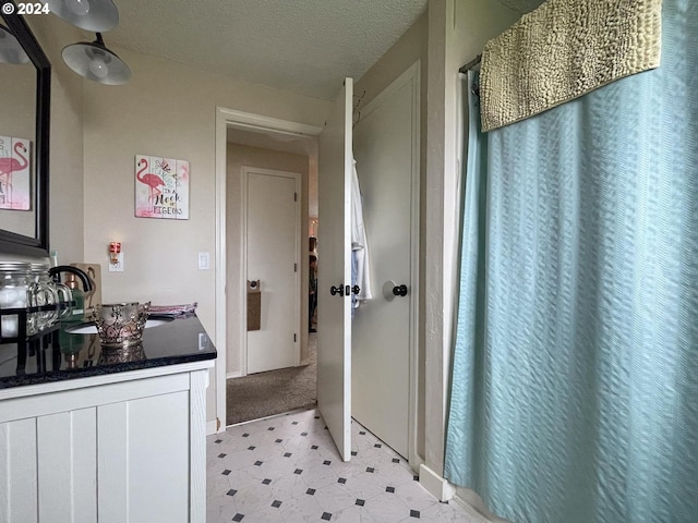 bathroom with a textured ceiling