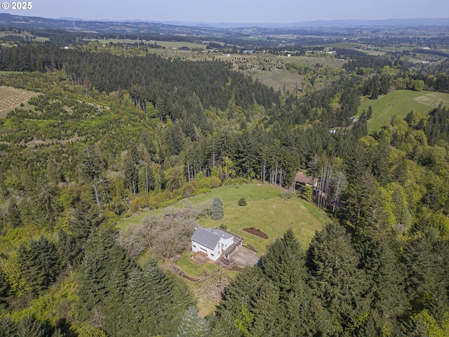 drone / aerial view with a view of trees