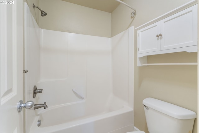 bathroom featuring toilet and tub / shower combination