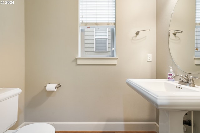 bathroom featuring toilet and sink