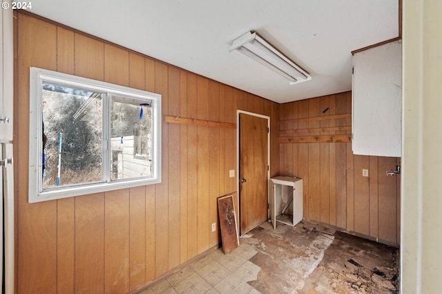 laundry room featuring wood walls