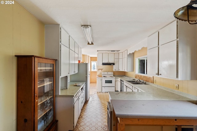 kitchen featuring electric stove, sink, white cabinets, and stainless steel dishwasher