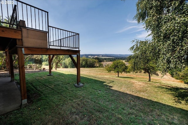 view of yard with a wooden deck